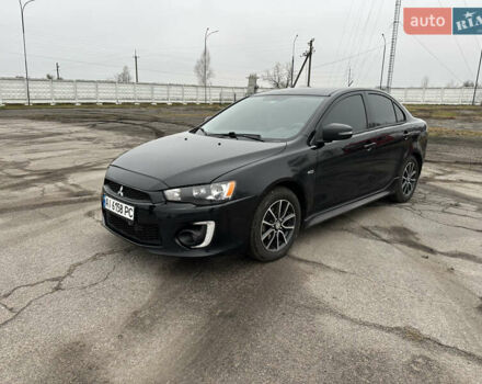 Черный Мицубиси Лансер, объемом двигателя 2 л и пробегом 142 тыс. км за 9500 $, фото 1 на Automoto.ua