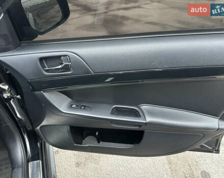 Черный Мицубиси Лансер, объемом двигателя 2 л и пробегом 142 тыс. км за 9500 $, фото 12 на Automoto.ua