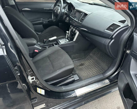 Черный Мицубиси Лансер, объемом двигателя 2 л и пробегом 142 тыс. км за 9500 $, фото 10 на Automoto.ua