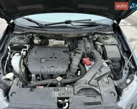 Черный Мицубиси Лансер, объемом двигателя 2 л и пробегом 142 тыс. км за 9500 $, фото 42 на Automoto.ua