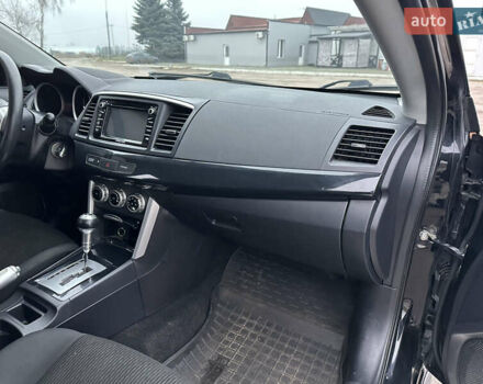 Черный Мицубиси Лансер, объемом двигателя 2 л и пробегом 142 тыс. км за 9500 $, фото 11 на Automoto.ua