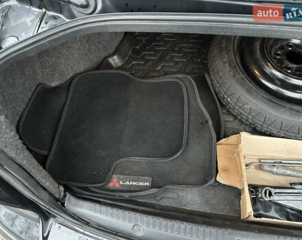 Черный Мицубиси Лансер, объемом двигателя 2 л и пробегом 142 тыс. км за 9500 $, фото 36 на Automoto.ua