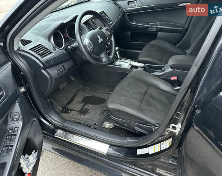 Черный Мицубиси Лансер, объемом двигателя 2 л и пробегом 142 тыс. км за 9500 $, фото 6 на Automoto.ua