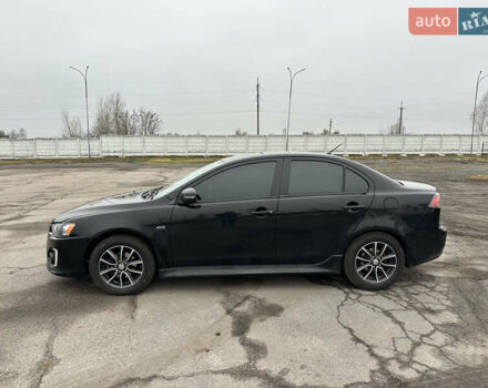 Черный Мицубиси Лансер, объемом двигателя 2 л и пробегом 142 тыс. км за 9500 $, фото 2 на Automoto.ua