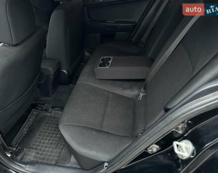 Черный Мицубиси Лансер, объемом двигателя 2 л и пробегом 142 тыс. км за 9500 $, фото 13 на Automoto.ua