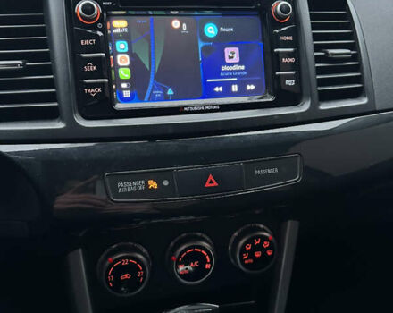 Черный Мицубиси Лансер, объемом двигателя 2 л и пробегом 142 тыс. км за 9500 $, фото 21 на Automoto.ua