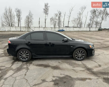 Черный Мицубиси Лансер, объемом двигателя 2 л и пробегом 142 тыс. км за 9500 $, фото 4 на Automoto.ua