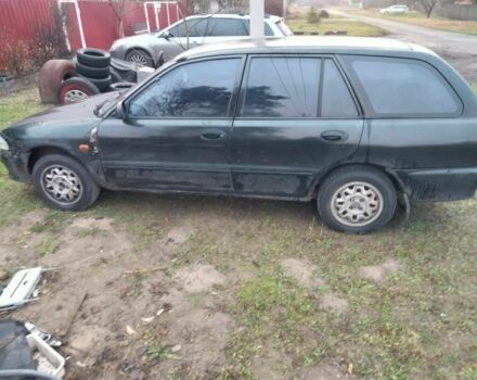 Черный Мицубиси Лансер, объемом двигателя 2 л и пробегом 380 тыс. км за 800 $, фото 3 на Automoto.ua