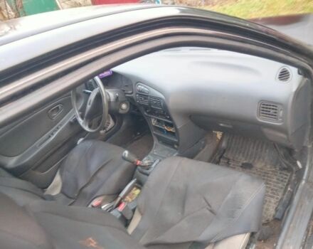 Черный Мицубиси Лансер, объемом двигателя 2 л и пробегом 380 тыс. км за 800 $, фото 2 на Automoto.ua