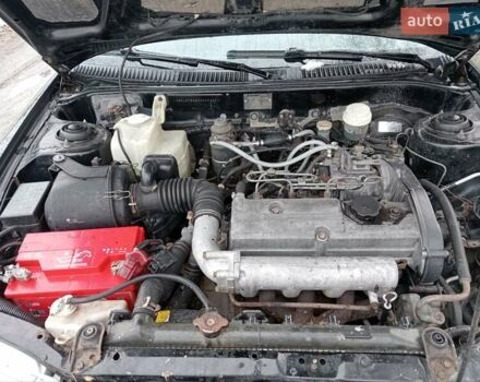 Чорний Міцубісі Lancer, об'ємом двигуна 2 л та пробігом 166 тис. км за 1699 $, фото 10 на Automoto.ua