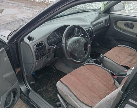 Чорний Міцубісі Lancer, об'ємом двигуна 2 л та пробігом 166 тис. км за 1699 $, фото 9 на Automoto.ua