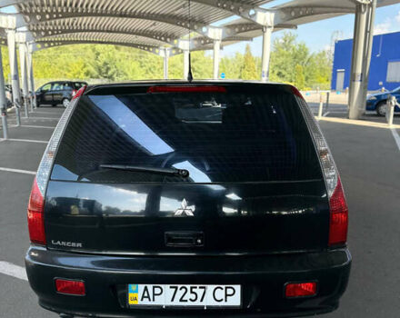 Черный Мицубиси Лансер, объемом двигателя 2 л и пробегом 410 тыс. км за 3900 $, фото 8 на Automoto.ua