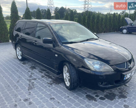 Чорний Міцубісі Lancer, об'ємом двигуна 2 л та пробігом 285 тис. км за 2550 $, фото 5 на Automoto.ua