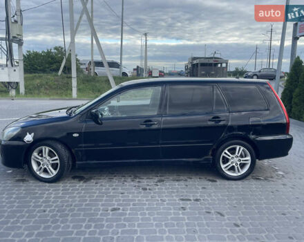 Чорний Міцубісі Lancer, об'ємом двигуна 2 л та пробігом 285 тис. км за 2550 $, фото 1 на Automoto.ua