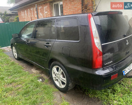 Чорний Міцубісі Lancer, об'ємом двигуна 2 л та пробігом 289 тис. км за 3600 $, фото 4 на Automoto.ua
