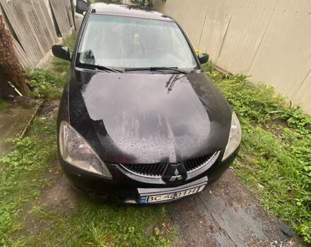Чорний Міцубісі Lancer, об'ємом двигуна 2 л та пробігом 289 тис. км за 3600 $, фото 1 на Automoto.ua