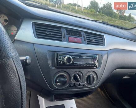 Чорний Міцубісі Lancer, об'ємом двигуна 2 л та пробігом 285 тис. км за 2550 $, фото 9 на Automoto.ua