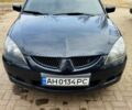 Чорний Міцубісі Lancer, об'ємом двигуна 2 л та пробігом 231 тис. км за 5350 $, фото 1 на Automoto.ua