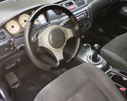 Міцубісі Lancer 2004 у Славянске на Automoto.ua Чорний Міцубісі Lancer, об'ємом двигуна 2 л та пробігом 231 тис. км за 5500 $, фото 6 на Automoto.ua