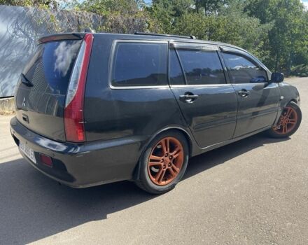 Черный Мицубиси Лансер, объемом двигателя 2 л и пробегом 175 тыс. км за 2850 $, фото 4 на Automoto.ua