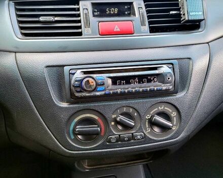 Чорний Міцубісі Lancer, об'ємом двигуна 1.6 л та пробігом 290 тис. км за 1999 $, фото 1 на Automoto.ua