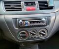 Чорний Міцубісі Lancer, об'ємом двигуна 1.6 л та пробігом 290 тис. км за 1999 $, фото 1 на Automoto.ua