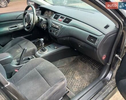 Чорний Міцубісі Lancer, об'ємом двигуна 2 л та пробігом 250 тис. км за 1850 $, фото 1 на Automoto.ua