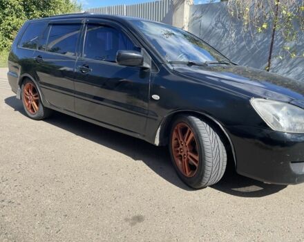 Черный Мицубиси Лансер, объемом двигателя 2 л и пробегом 175 тыс. км за 2850 $, фото 5 на Automoto.ua