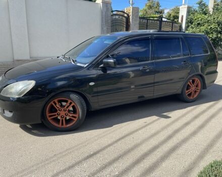 Черный Мицубиси Лансер, объемом двигателя 2 л и пробегом 175 тыс. км за 2850 $, фото 1 на Automoto.ua