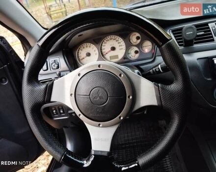 Міцубісі Lancer 2004 у Славянске на Automoto.ua Чорний Міцубісі Lancer, об'ємом двигуна 2 л та пробігом 231 тис. км за 5500 $, фото 5 на Automoto.ua