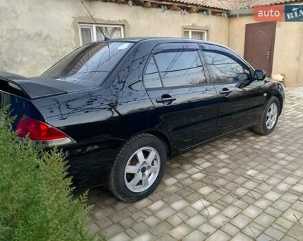 Чорний Міцубісі Lancer, об'ємом двигуна 1.6 л та пробігом 121 тис. км за 3900 $, фото 4 на Automoto.ua