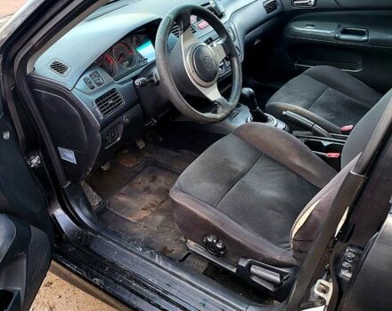 Чорний Міцубісі Lancer, об'ємом двигуна 1.6 л та пробігом 290 тис. км за 1999 $, фото 2 на Automoto.ua