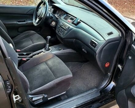 Чорний Міцубісі Lancer, об'ємом двигуна 1.6 л та пробігом 290 тис. км за 1999 $, фото 9 на Automoto.ua