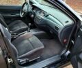 Чорний Міцубісі Lancer, об'ємом двигуна 1.6 л та пробігом 290 тис. км за 1999 $, фото 9 на Automoto.ua
