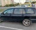 Черный Мицубиси Лансер, объемом двигателя 2 л и пробегом 318 тыс. км за 2900 $, фото 1 на Automoto.ua