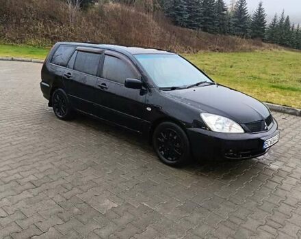 Черный Мицубиси Лансер, объемом двигателя 1.58 л и пробегом 336 тыс. км за 2600 $, фото 1 на Automoto.ua