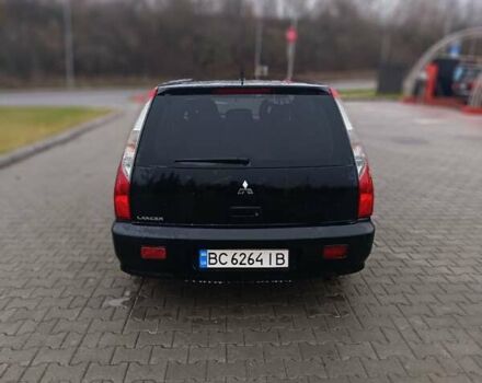 Черный Мицубиси Лансер, объемом двигателя 1.58 л и пробегом 336 тыс. км за 2600 $, фото 4 на Automoto.ua