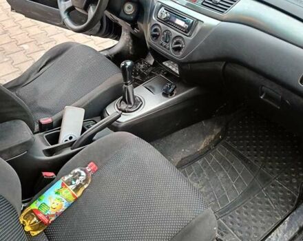 Черный Мицубиси Лансер, объемом двигателя 1.58 л и пробегом 336 тыс. км за 2600 $, фото 11 на Automoto.ua