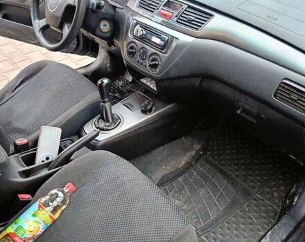 Черный Мицубиси Лансер, объемом двигателя 1.58 л и пробегом 336 тыс. км за 2600 $, фото 13 на Automoto.ua