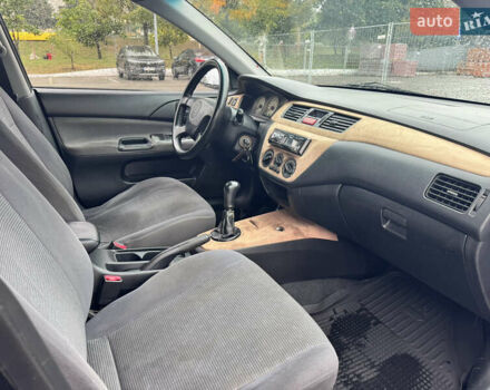 Міцубісі Lancer 2005 у Києві на Automoto.ua Чорний Міцубісі Lancer, об'ємом двигуна 1.6 л та пробігом 408 тис. км за 3900 $, фото 8 на Automoto.ua