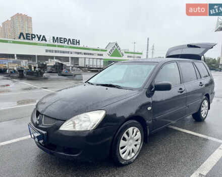 Міцубісі Lancer 2005 у Києві на Automoto.ua Чорний Міцубісі Lancer, об'ємом двигуна 1.6 л та пробігом 408 тис. км за 3900 $, фото 4 на Automoto.ua