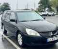 Міцубісі Lancer 2005 у Києві на Automoto.ua Чорний Міцубісі Lancer, об'ємом двигуна 1.6 л та пробігом 408 тис. км за 3900 $, фото 1 на Automoto.ua