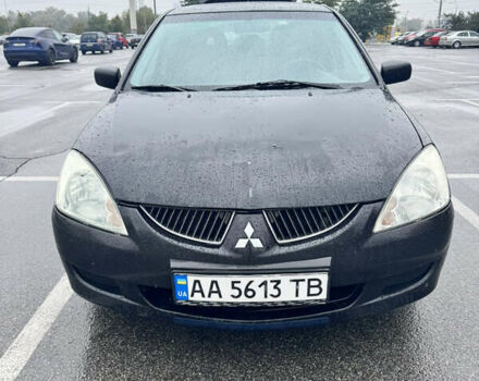 Міцубісі Lancer 2005 у Києві на Automoto.ua Чорний Міцубісі Lancer, об'ємом двигуна 1.6 л та пробігом 408 тис. км за 3900 $, фото 3 на Automoto.ua