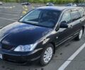 Міцубісі Lancer 2005 у Києві на Automoto.ua Чорний Міцубісі Lancer, об'ємом двигуна 1.6 л та пробігом 245 тис. км за 4000 $, фото 1 на Automoto.ua