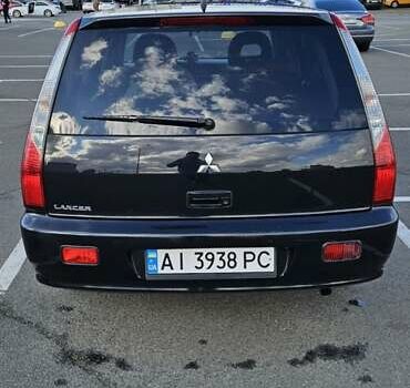 Міцубісі Lancer 2005 у Києві на Automoto.ua Чорний Міцубісі Lancer, об'ємом двигуна 1.6 л та пробігом 245 тис. км за 4000 $, фото 2 на Automoto.ua