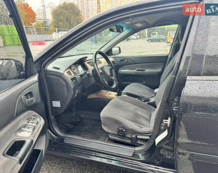 Міцубісі Lancer 2005 у Києві на Automoto.ua Чорний Міцубісі Lancer, об'ємом двигуна 1.6 л та пробігом 408 тис. км за 3900 $, фото 6 на Automoto.ua