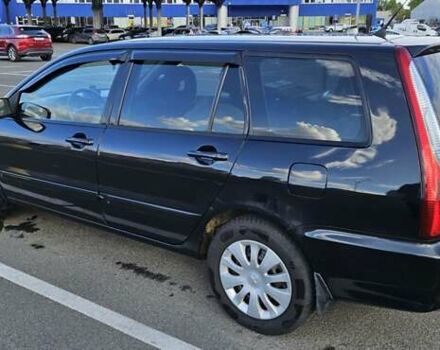Міцубісі Lancer 2005 у Києві на Automoto.ua Чорний Міцубісі Lancer, об'ємом двигуна 1.6 л та пробігом 245 тис. км за 4000 $, фото 1 на Automoto.ua