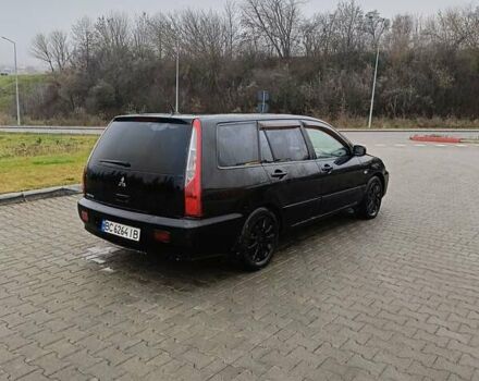 Черный Мицубиси Лансер, объемом двигателя 1.58 л и пробегом 336 тыс. км за 2600 $, фото 7 на Automoto.ua