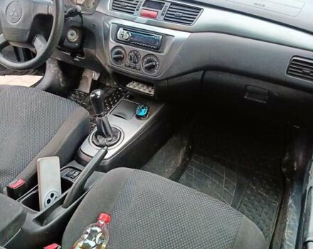 Черный Мицубиси Лансер, объемом двигателя 1.58 л и пробегом 336 тыс. км за 2600 $, фото 8 на Automoto.ua