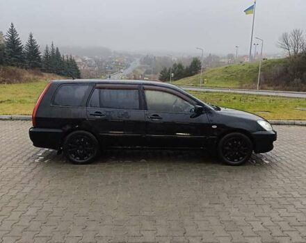 Черный Мицубиси Лансер, объемом двигателя 1.58 л и пробегом 336 тыс. км за 2600 $, фото 6 на Automoto.ua